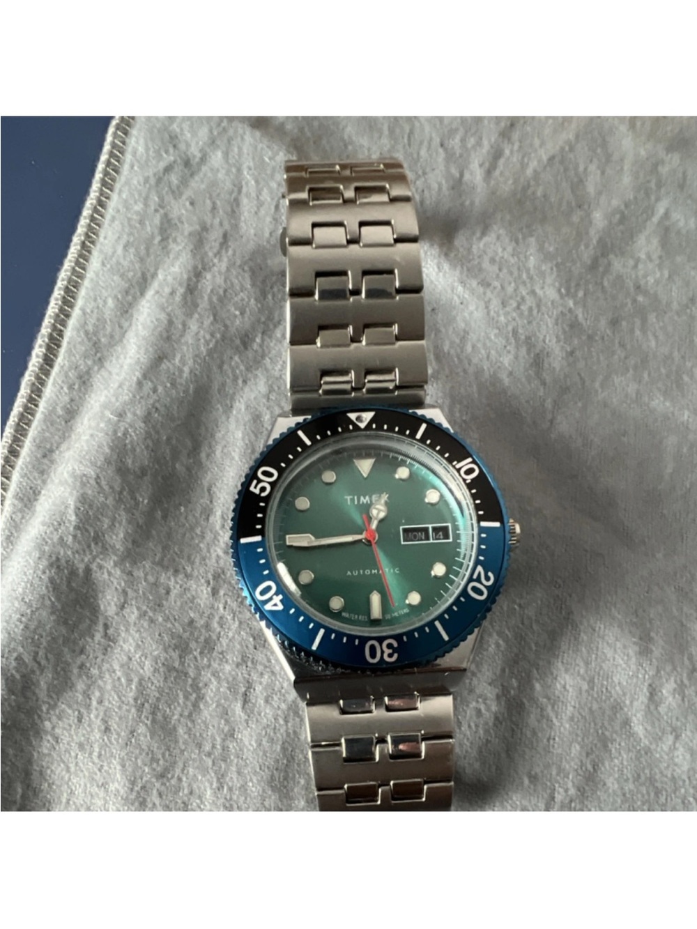 The Timex M79 Automatic.Timex Green Dial with Blue Bezel Stainless Dive Watch